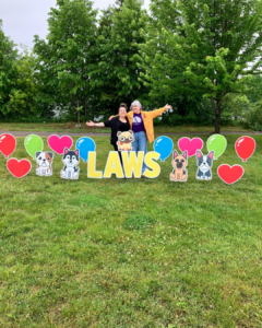 LAWS staff with lawn signs